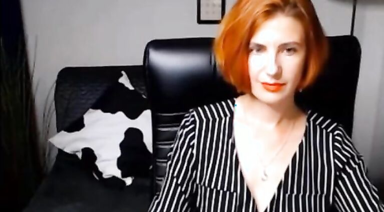 Red head MILF stripping on webcam.