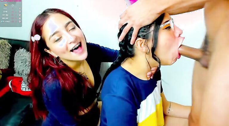 One Latina nibbles the cock while the other gets throated