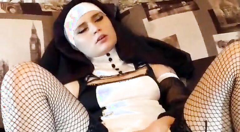Horny nun Christa Hell toys herself with a dildo