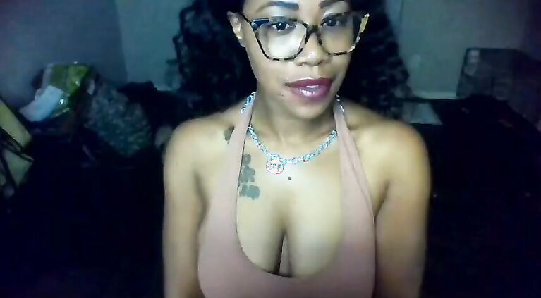 Busty Ebony drools on her big brown boobs